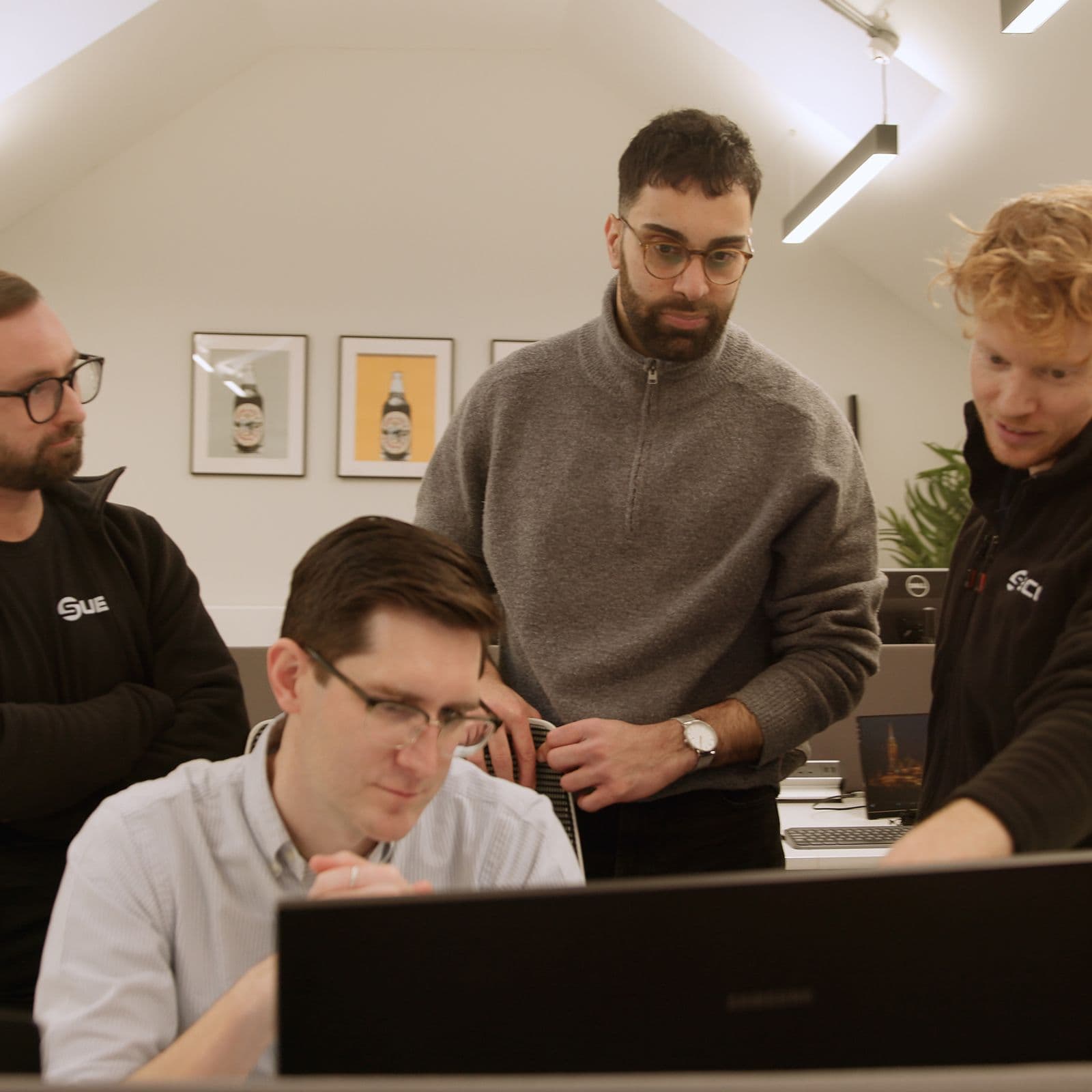 Subco engineers discussing a technical drawing together